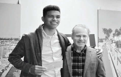 Junior Alexander Kowal receives his $500 prize from Dr. Robert Nolan,
contest co-sponsor. Photo courtesy of the Cancer Support Community Redondo Beach.
