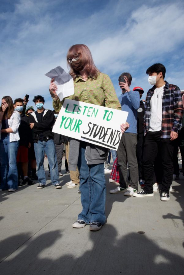 Junior Sam Miller read her speech, but was unable to be heard above the crowds shouts. “To the school district, I’d like you think of who your institution is founded off of, which is students, and how you are continuously ignoring them and choosing not to listen to their voices, she said.