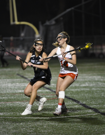 During a game against Oak Park, junior Maxine Hoffman breaks away from an opponent and passes to an open teammate. Redondo ultimately won 20-4. 