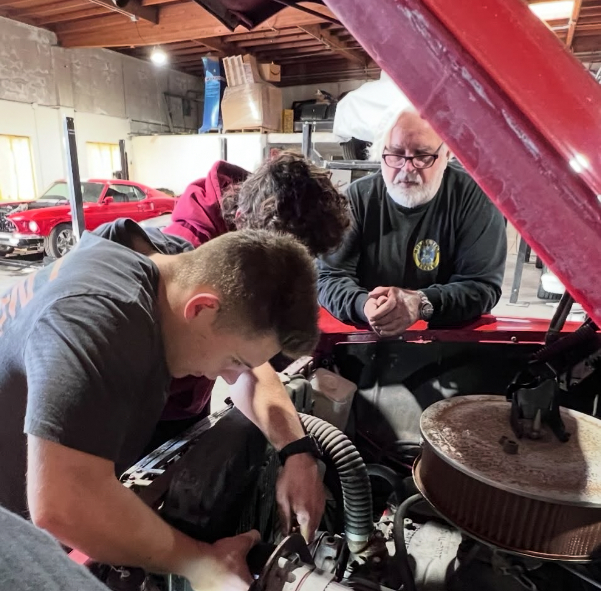 Auto Club members working on their project car.
Courtesy of Robert Packard.